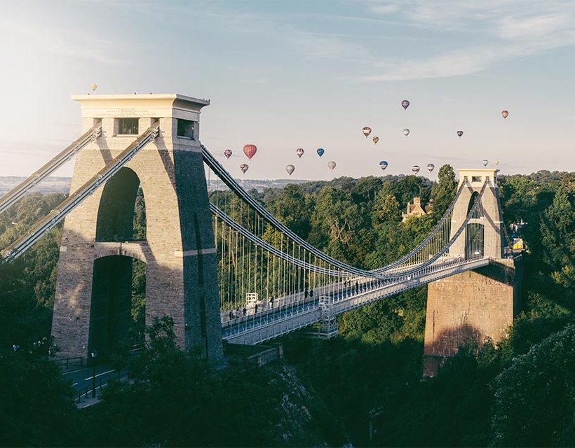 A scenic view of a UK bridge spanning a calm river, symbolizing connection and crossing into new perspectives, reflective of the therapeutic journey at Andreia Fortes Counselling.